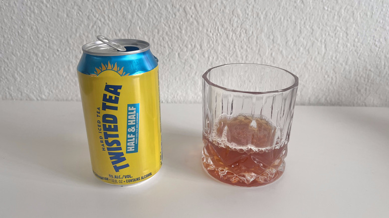 Half & Half Twisted Tea can next to a glass