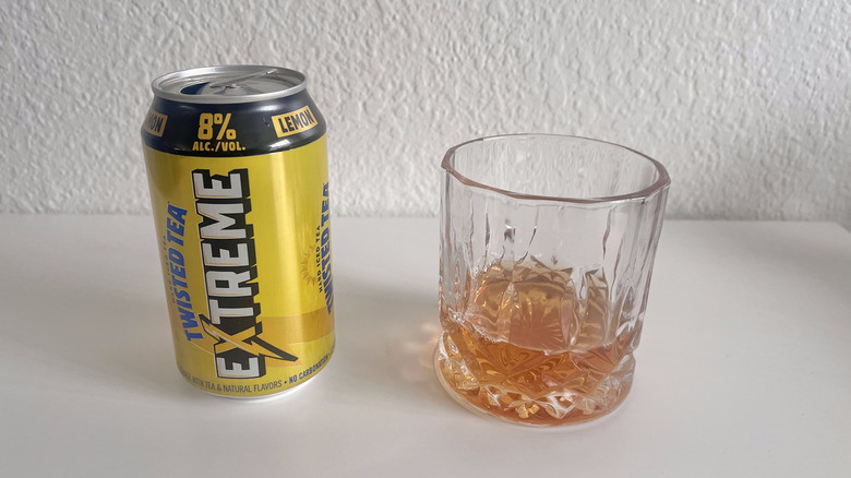 A can of Extreme Lemon Twisted Tea next to a glass