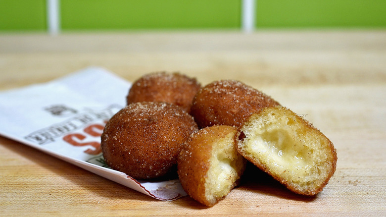 Cinnabon Delights from Taco Bell on paper wrapped on wooden table