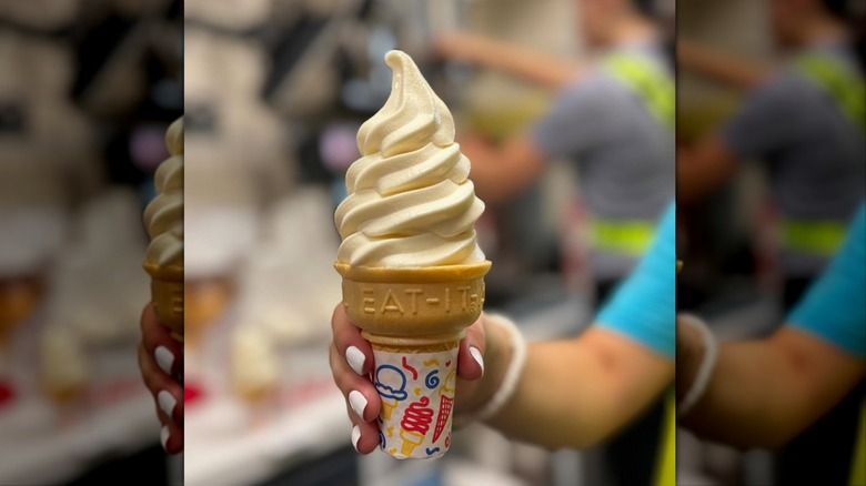 Hand holding Icedream cone from Chick-fil-A