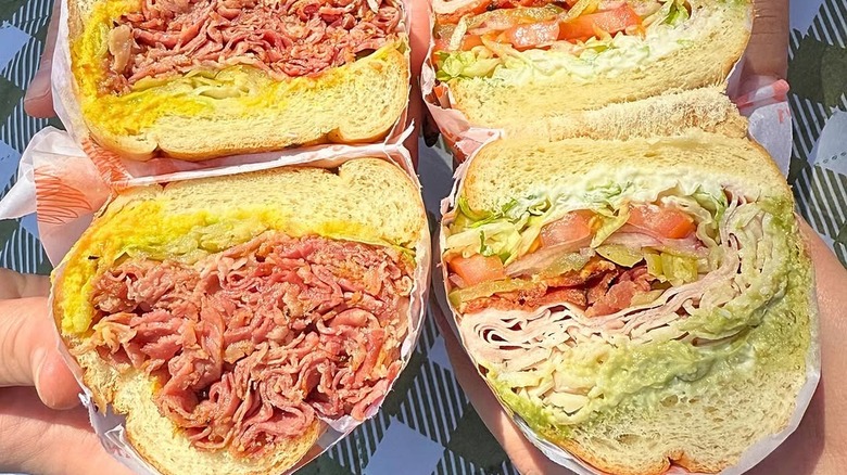 two togo's sub sandwiches cut in half