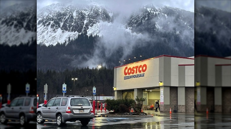 The exterior of Juneau Costco against a misty forest