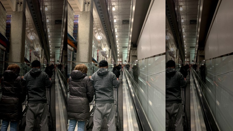 Costco customers using an escalator