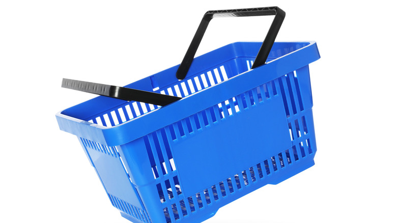 Blue grocery store shopping basket on white background