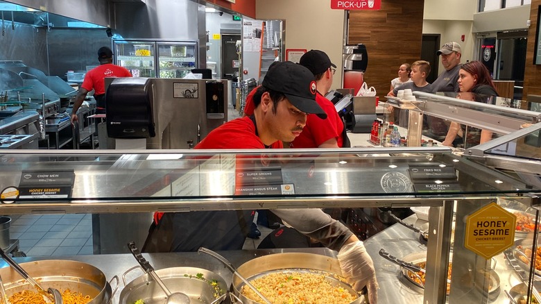 Panda Express employee working behind the counter
