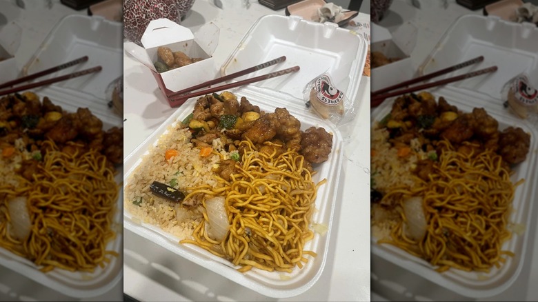 Plate of Panda Express food featuring chow mien, chicken, and fried rice