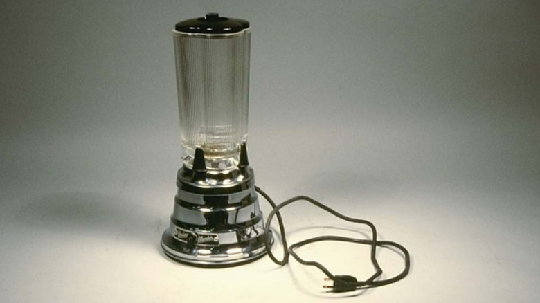 a vintage 1930s Waring blender ("Blendor") from the Smithsonian collection, shown on a subdued gray background
