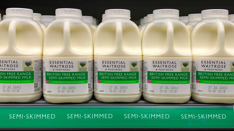 Cartons of semi-skimmed milk on store shelf