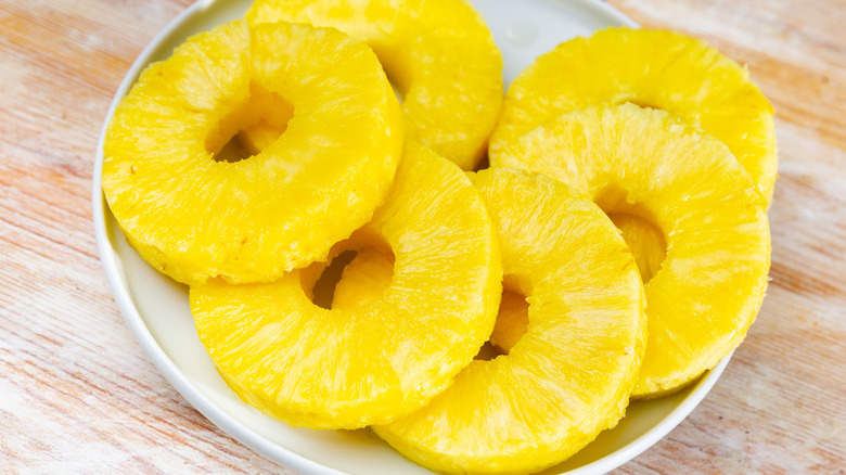 pineapple sliced and served on white plate