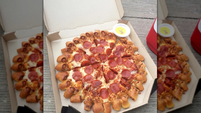 Mirrored image of Pizza Hut's Hot Dog Crust pizza in box