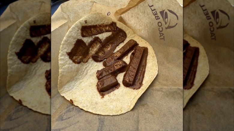 Melted chocolate on tortilla on Taco Bell paper packaging, mirrored image