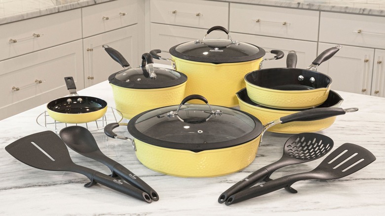 entire paula deen cookware collection on a white kitchen island