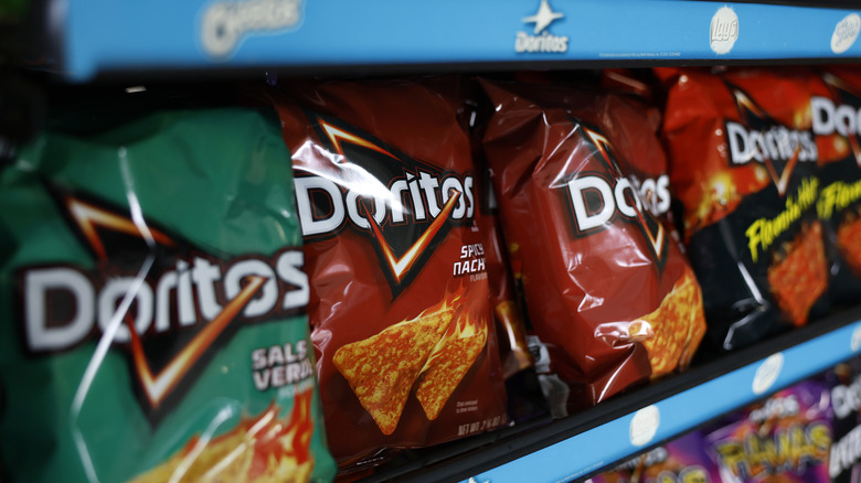 Bags of Doritos chips on display at a grocery store
