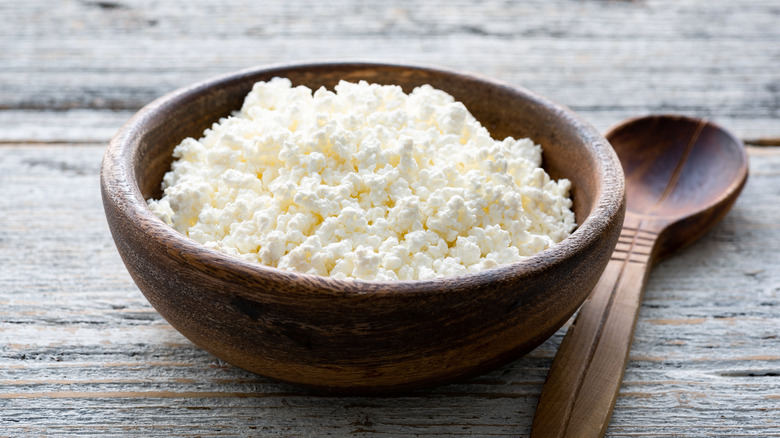 ricotta in wood bowl, spoon