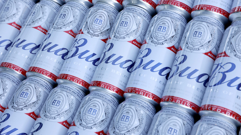 Budweiser cans stacked in row