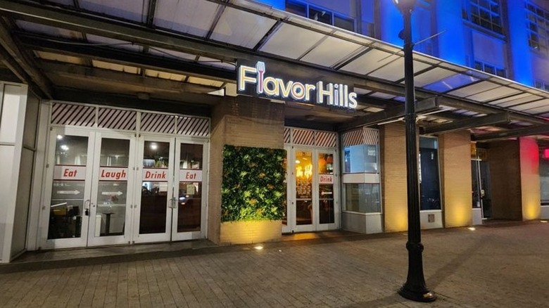 front of Flavor Hills restaurant in Raleigh, North Carolina at night