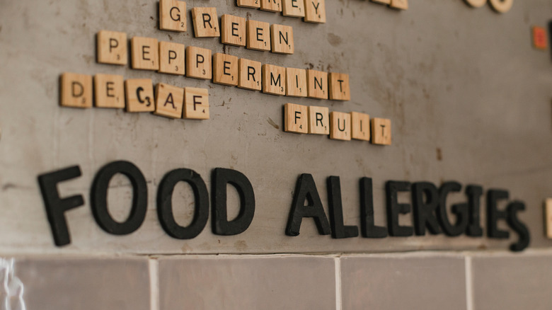 A magnetic menu with "food allergies" spelled out