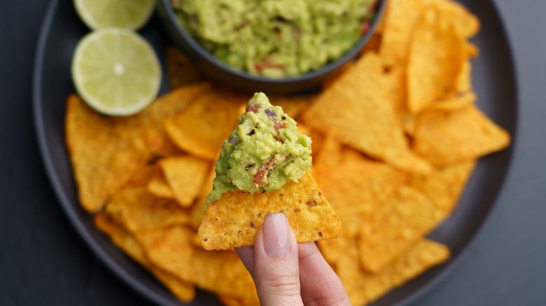 chips dipped in guac 