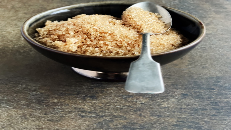 Bowl of brown sugar with a spoon