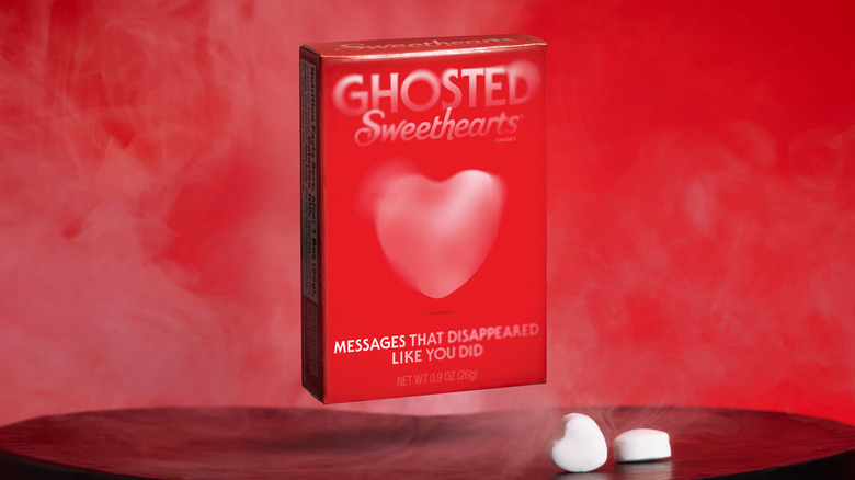 A red box of Ghosted Sweethearts candy hovering over a table