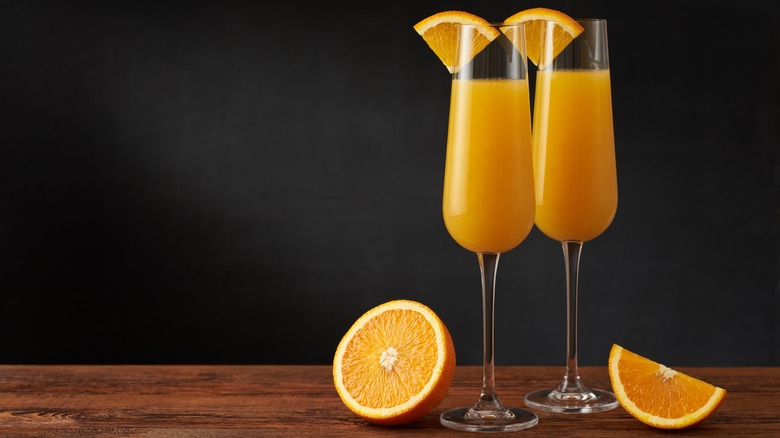 two mimosas with orange slices