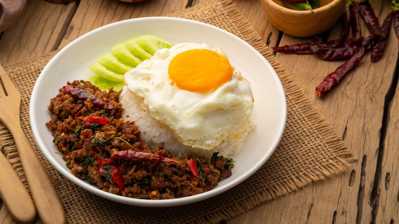 Thai basil minced beef with egg, rice, and cucumber