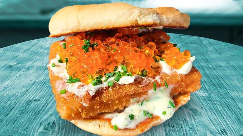 Fish sandwich topped with trout roe