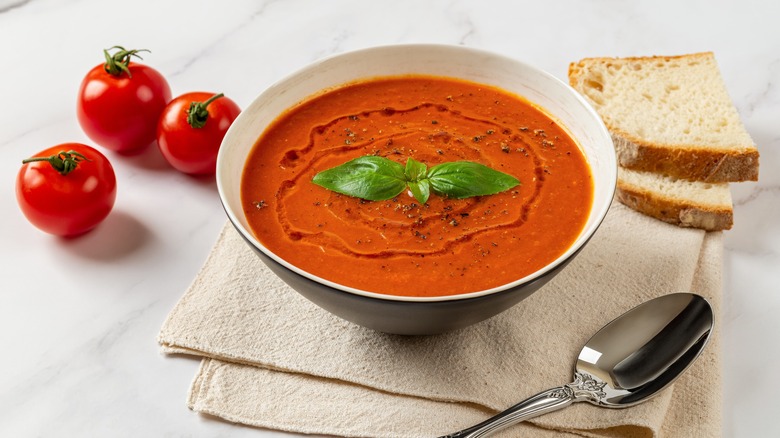 Bowl of roasted tomato soup drizzled with anchovy oil