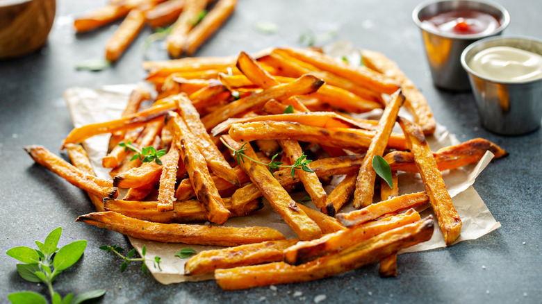 french fries on paper with seasoning