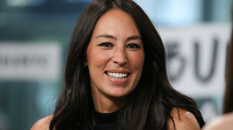Joanna Gaines smiles looking forward