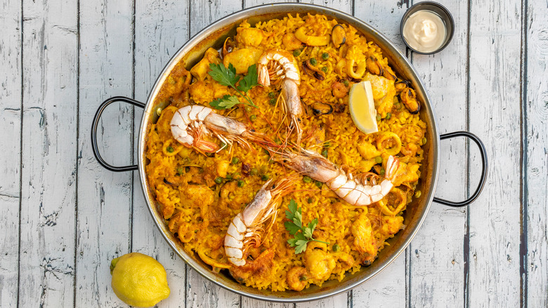 Paella in a pot on table