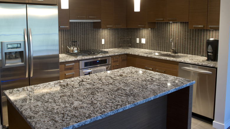 kitchen featuring granite counter tops and stainless steel appliances