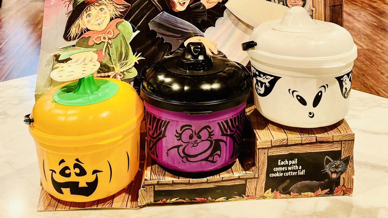 Three McDonald's Boo Buckets in purple witch, white ghost, and orange pumpkin designs