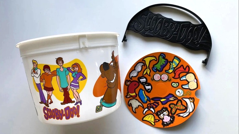 McDonald's Scooby Doo Boo Bucket next to sticker sheet on white surface