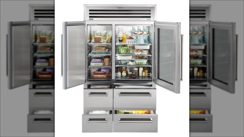 Sub-Zero 48" PRO Refrigerator/Freezer full of food and with open doors on white background