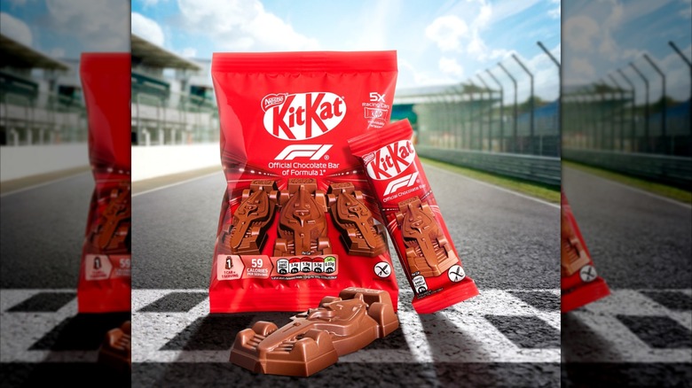 Photo of formula-shaped KitKat chocolates with a racetrack in the background