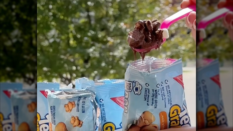 scoop of a walking s'mores taco from a Teddy Graham bag