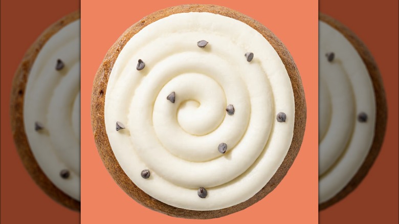 Crumbl's Pumpkin Cake Cookie on orange background