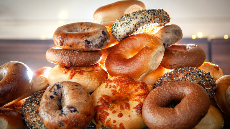 stack of different types of bagels at Leña Pizza + Bagels