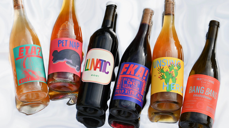 Several bottles of red and orange wine from subject to change Wine Company