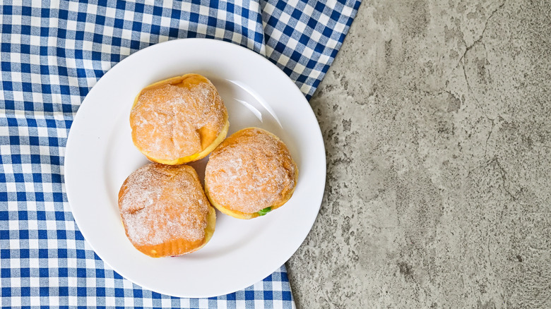Filled donuts on plate