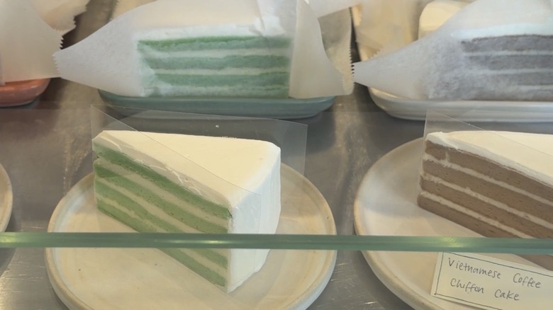 Banh by Lauren layered chiffon cakes in display cabinet in her cafe in NYC