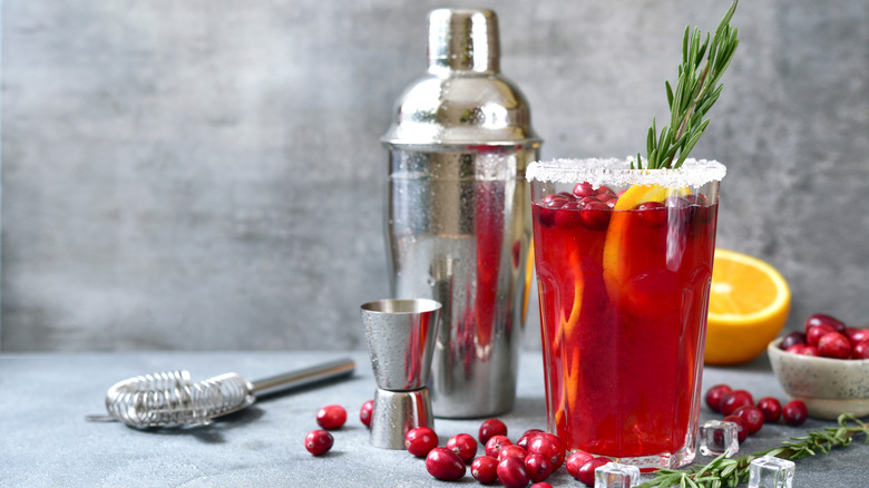 Cranberry lemonade cocktail with a cocktail shaker in the background