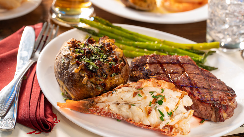Steak and lobster meal on a plate