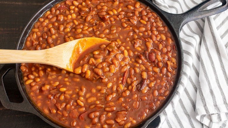 baked beans with wooden spoon