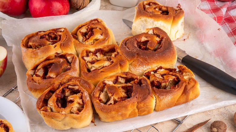 Apple sweet rolls on parchment paper