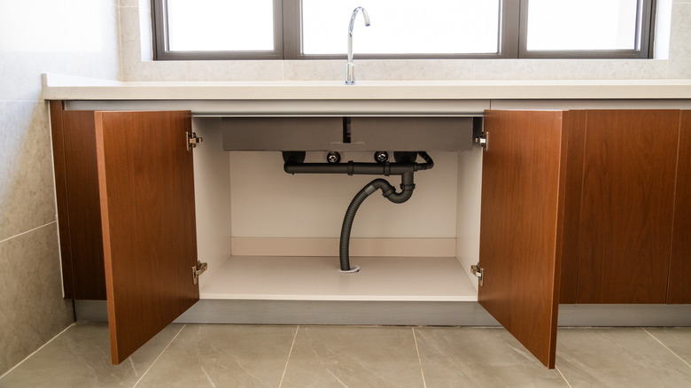Open kitchen cabinets under the sink
