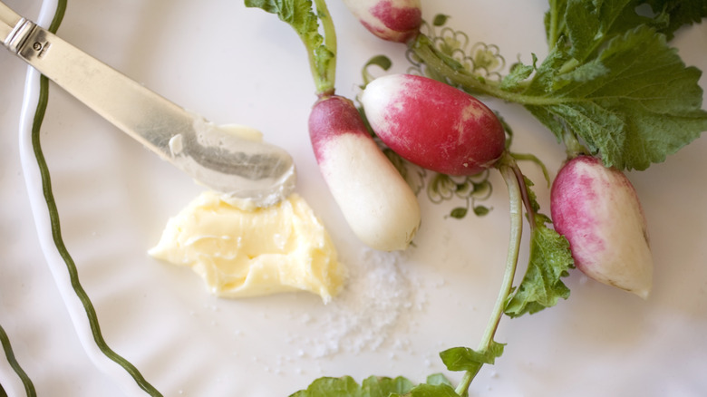 radishes with butter and salt on platter