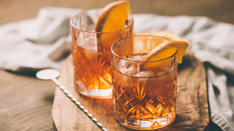 Glasses of bourbon with orange slices