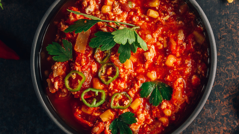 bowl of spicy chili with peppers